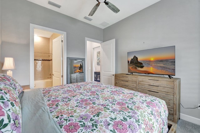 carpeted bedroom featuring ceiling fan and ensuite bath