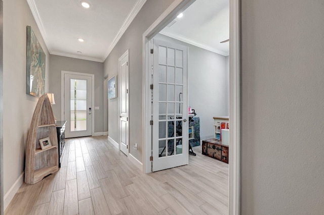 entrance foyer featuring light hardwood / wood-style flooring and ornamental molding