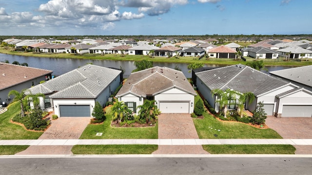 birds eye view of property featuring a water view