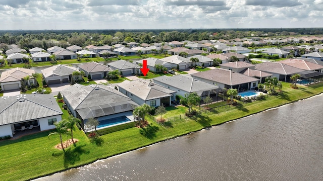 birds eye view of property featuring a water view