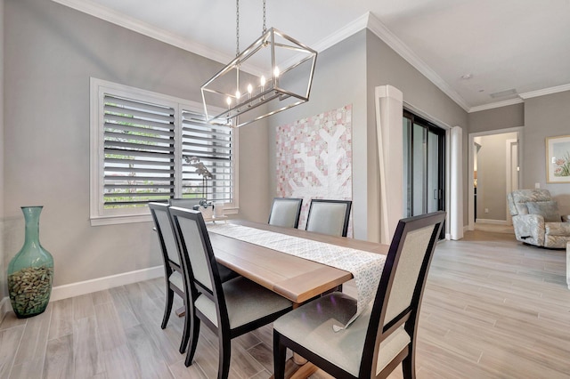 dining space with an inviting chandelier, ornamental molding, and light wood-type flooring