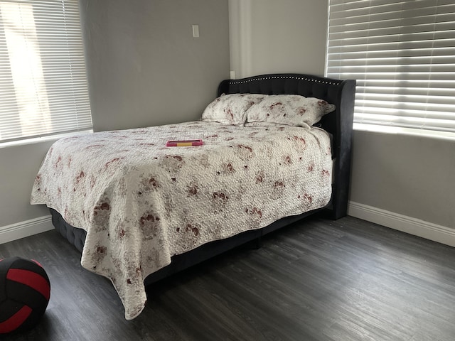 bedroom featuring dark wood-type flooring