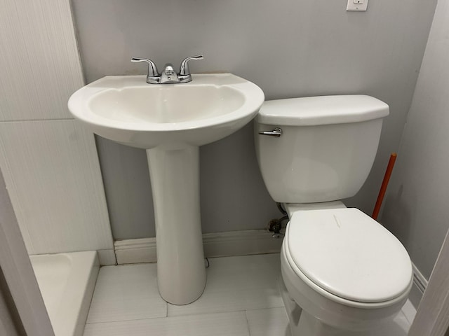 bathroom featuring tile patterned floors and toilet