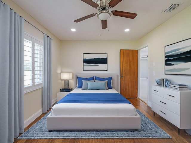 bedroom featuring hardwood / wood-style flooring and ceiling fan