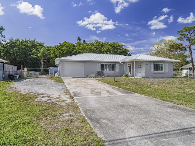 ranch-style home with a garage and a front yard