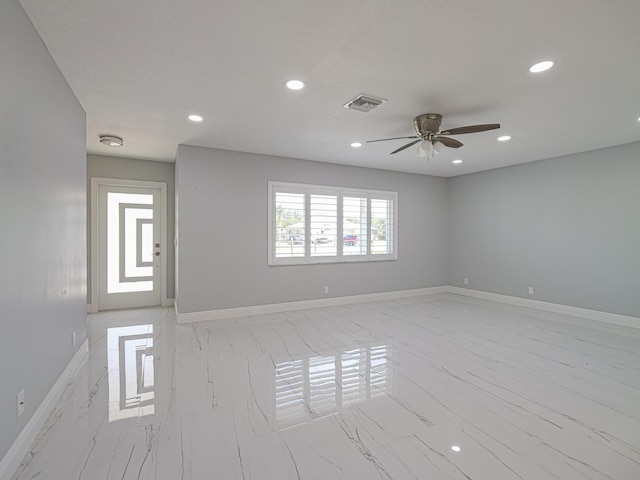 spare room featuring ceiling fan