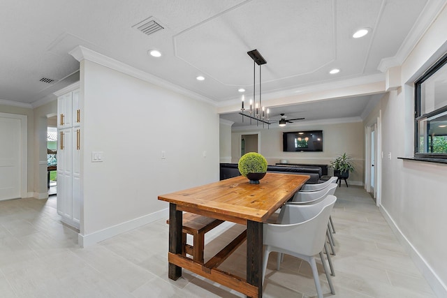 dining area featuring crown molding and ceiling fan