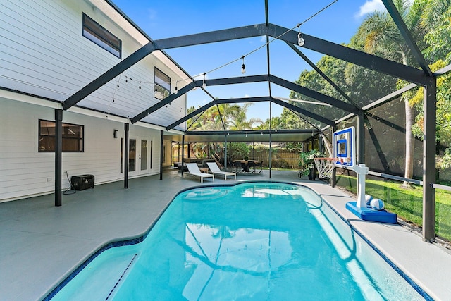 view of pool with a lanai and a patio area