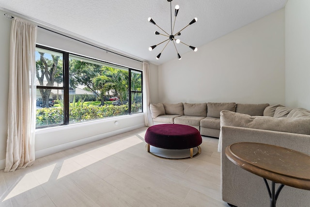 living room featuring lofted ceiling, a textured ceiling, and a notable chandelier