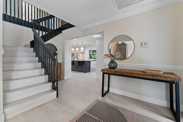 entryway featuring a textured ceiling