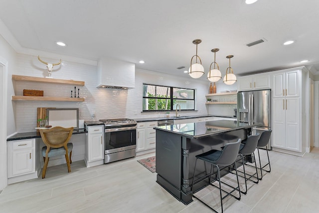 kitchen featuring white cabinetry, custom exhaust hood, stainless steel appliances, and a kitchen breakfast bar