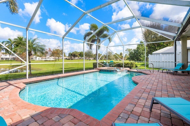 view of swimming pool featuring an in ground hot tub, a lawn, glass enclosure, and a patio