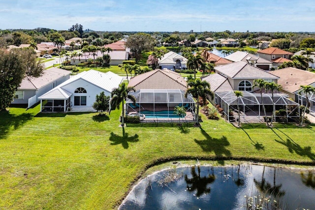 drone / aerial view featuring a water view