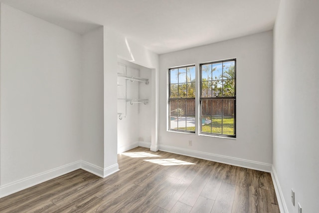 interior space with hardwood / wood-style floors and a closet