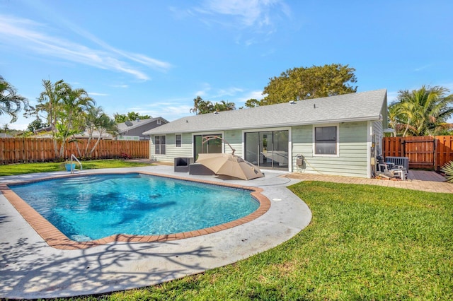 view of pool featuring a patio area and a lawn