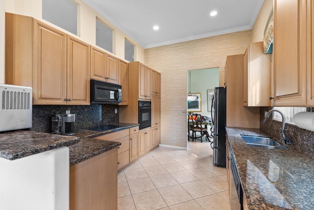 kitchen with light tile patterned floors, a sink, ornamental molding, light brown cabinetry, and black appliances