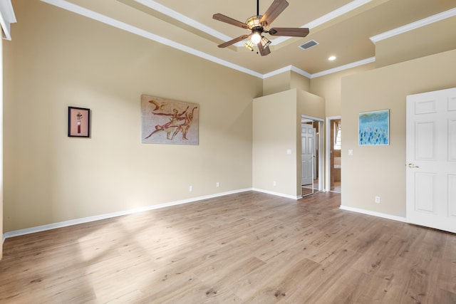 interior space with crown molding, recessed lighting, visible vents, wood finished floors, and baseboards