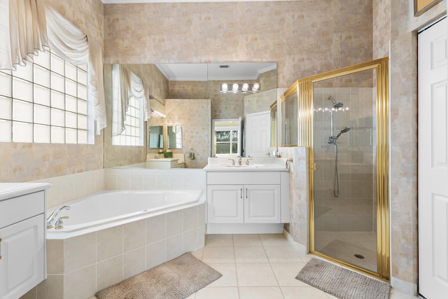 full bathroom with a garden tub, vanity, tile patterned floors, a stall shower, and crown molding