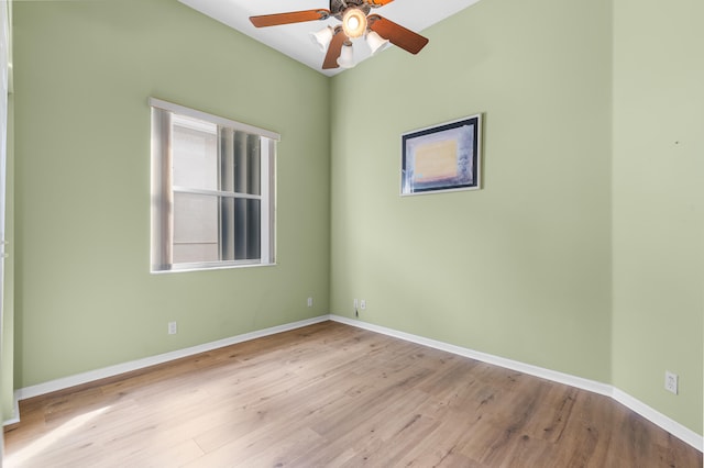 unfurnished room featuring a ceiling fan, baseboards, and wood finished floors