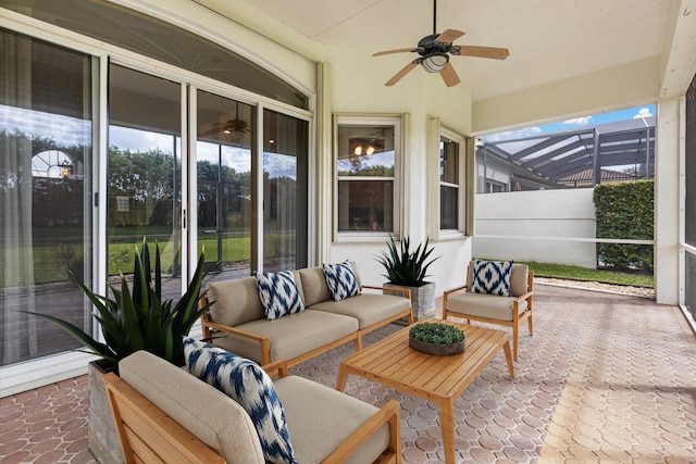 sunroom with a ceiling fan