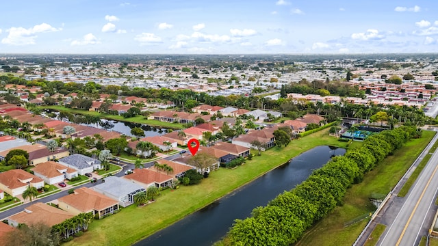 aerial view with a residential view and a water view