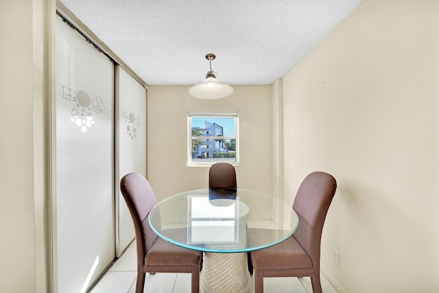 dining area with a textured ceiling