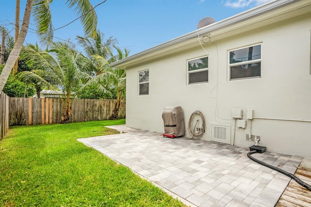 exterior space featuring a yard and a patio