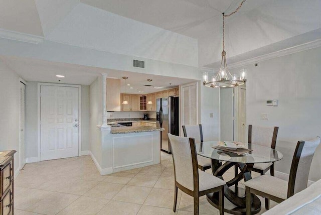 tiled dining room with crown molding and a notable chandelier