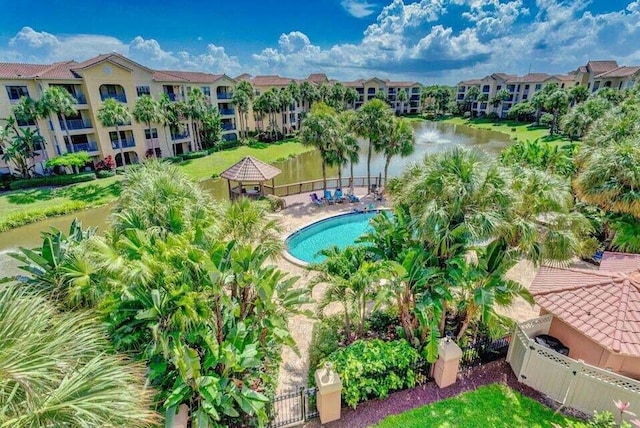 view of swimming pool with a water view