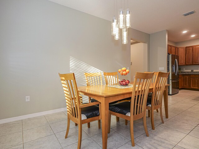 dining space with light tile patterned flooring