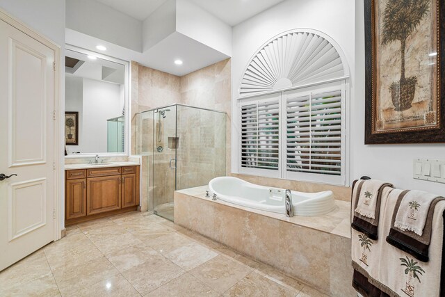 bathroom featuring vanity and a shower with shower door