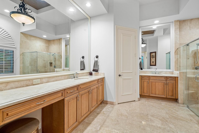 bathroom with an enclosed shower and vanity