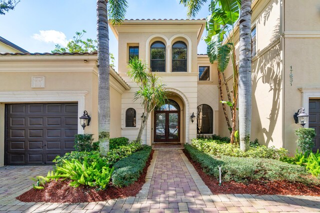 entrance to property featuring french doors