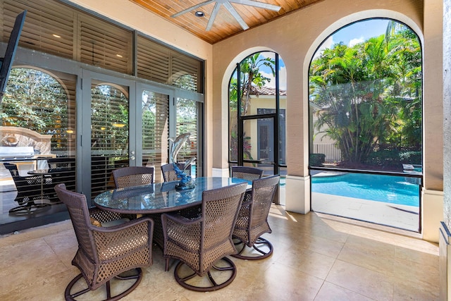 sunroom featuring wood ceiling