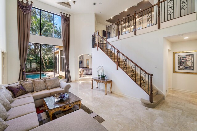 living room with a towering ceiling