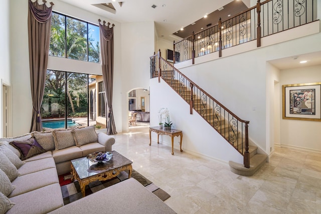 living room with a towering ceiling