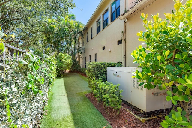 view of home's exterior with a yard