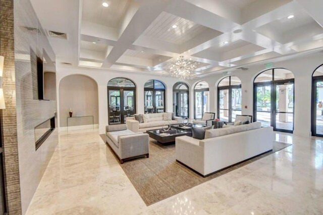 exercise room featuring crown molding