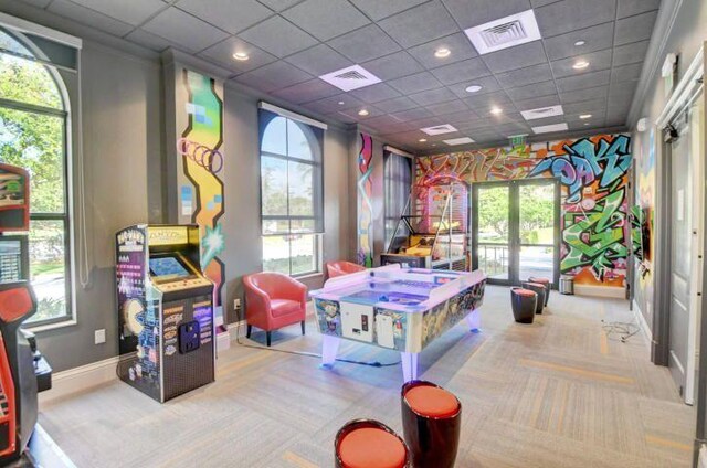 recreation room with wine cooler, light colored carpet, pool table, a tray ceiling, and bar area