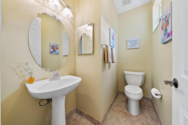 bathroom featuring tile patterned floors and toilet