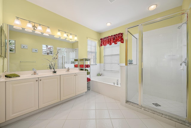 bathroom featuring vanity, tile patterned floors, and plus walk in shower