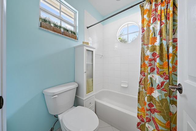 bathroom featuring toilet and shower / bath combo with shower curtain