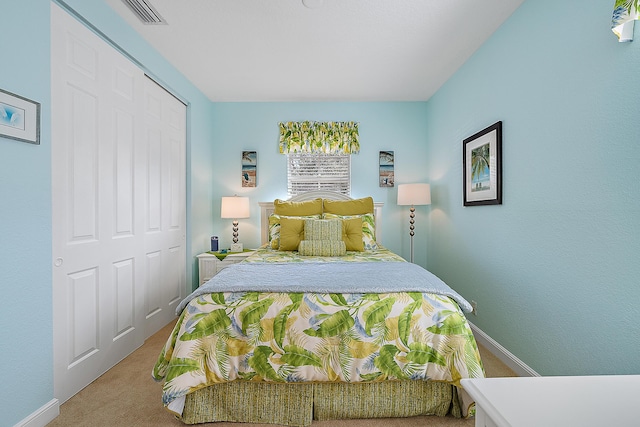 carpeted bedroom featuring a closet