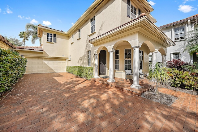 view of patio / terrace featuring a garage