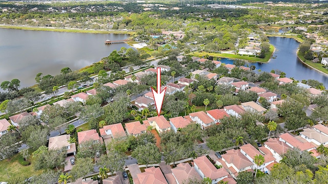 birds eye view of property featuring a water view