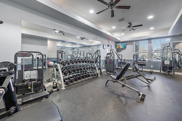 gym with a raised ceiling