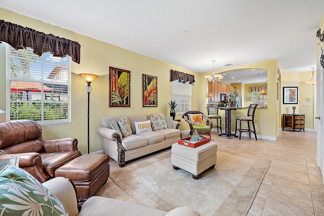 tiled living room with a textured ceiling