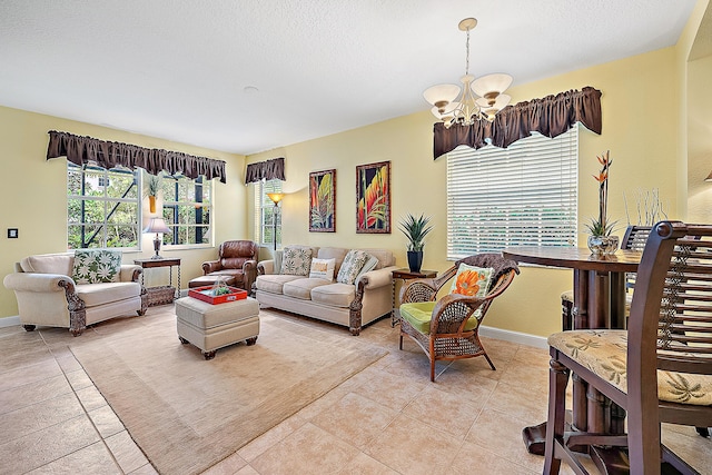 tiled living room with a chandelier and a textured ceiling