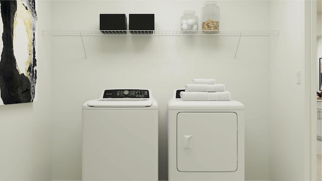 laundry area with washer and clothes dryer