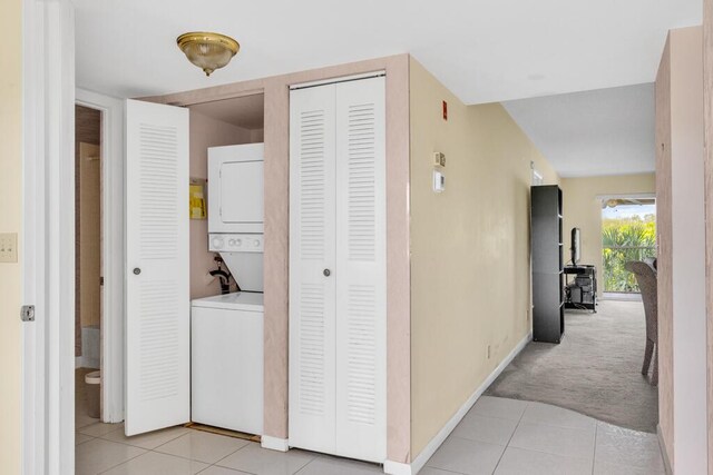 corridor with sink and light carpet